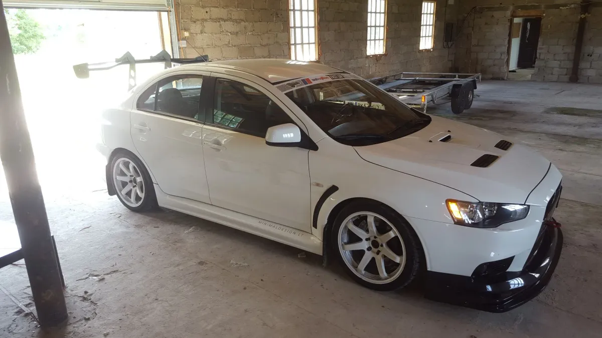 Mitsubishi Lancer Evolution X with a GRAMS front bumper and front lip