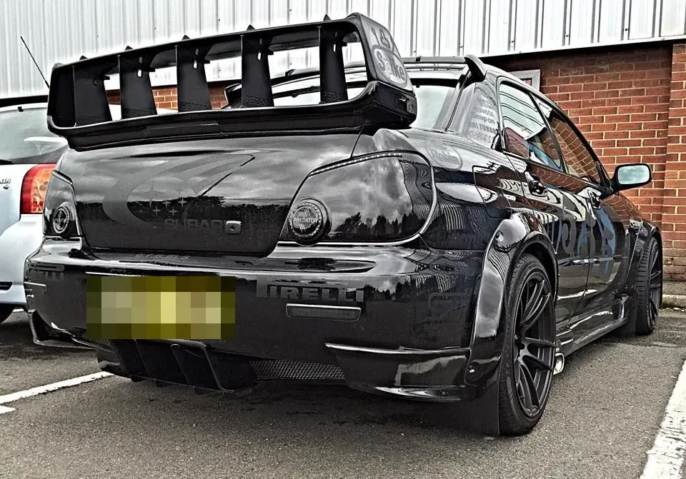 Subaru Impreza with a GRAMS rear diffuser, wide arches and side skirts